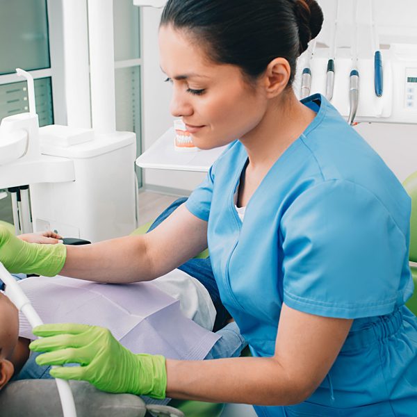 Pediatric,Dentist,Doing,Inhalation,Sedation,To,A,Child,While,Teeth