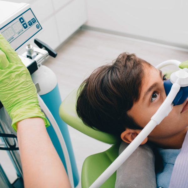 Little,Boy,Getting,Inhalation,Sedation,While,Teeth,Treatment,At,Dental